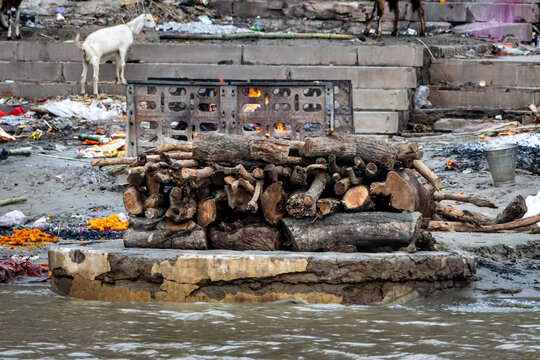 Wooden pyre for use in body cremation on the banks of the Ganges River in Varanasi in India. Manikarnika Ghat