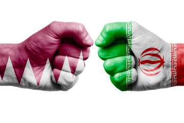 QATAR vs IRAN confrontation, religious conflict. Men's fists with painted flags of QATAR and IRAN.