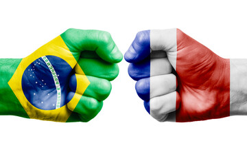 BRAZIL vs COSTA RICA confrontation, religious conflict. Men's fists with painted flags of BRAZIL and COSTA RICA.