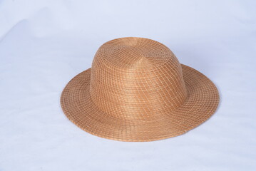 Fototapeta na wymiar Panama hat style straw hat with black ribbon isolated on white background, straw hat for woman and man head protection image