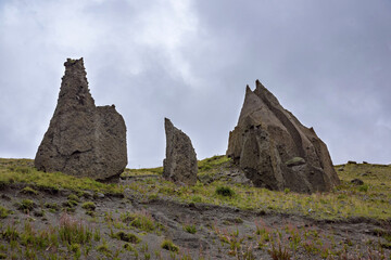 Fototapeta na wymiar Big lumps of rock in the green valley, North Caucasus, Russia