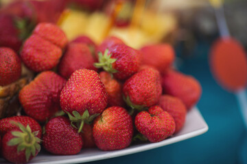 Buffet reception fruit, wines, champagne.fruit plate on wedding table. catering canape assorted fresh fruits, berries and citrus. Fruits for the holidays. Restaurant service at the event.