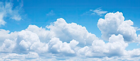 Naklejka na ściany i meble Puffy clouds in a sky of azure