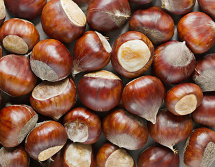 Sweet Chestnuts Top view. Copy space. Pile of ripe chestnuts for food background closeup.