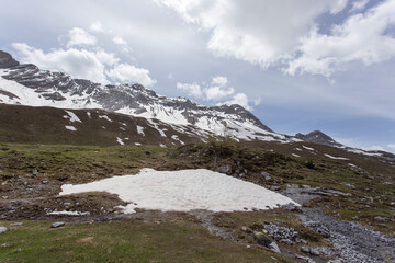 Some snow remaining on top of mountain in late spring