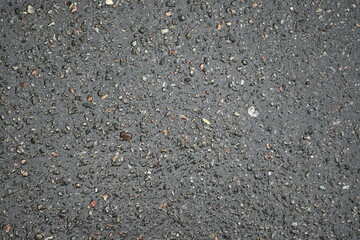 wet pavement texture, gray asphalt texture with red and white gravels 