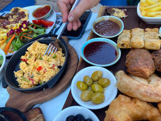 Turkish breakfast with pastries and sausage.