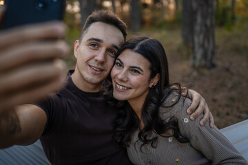 Man and woman young adult couple in nature self portrait selfie ugc