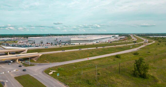 Aerial drone time lapse of a large factory building in Austin Texas.