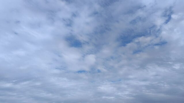 Early morning landscape with altocumulus clouds moving across the sky