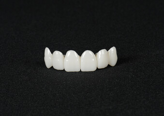 Zircon dentures on a dark background