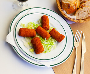 Spanish flamenquines, breaded pork loin rolled with serrano ham, typical of Andalusia