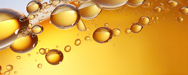 Oil bubbles of yellow and green colour of fresh olive oil. Macro photo.