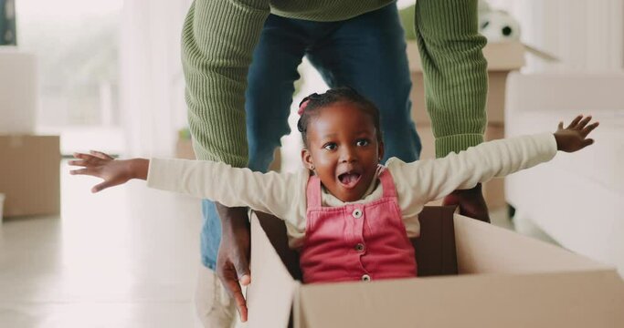 Child, father and pushing box in new house for playing games or race with speed for bond, love or happiness. Dad, excited or African kid in car with support or helping hand on floor in family home