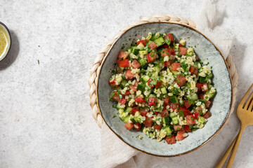 Tabbouleh salad. Traditional middle eastern or arab dish. Levantine vegetarian salad with parsley,...