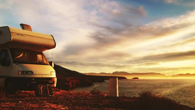 Seaside landscape with camper camping on cliff. Mediterranean region of Mazarron, Sierra de las Moreras in Murcia Spain. Motorhome vacation.