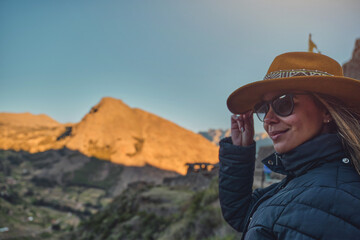 traveler hipster girl in hat with backpack exploring Pisac Archaeological of Peru. - obrazy, fototapety, plakaty