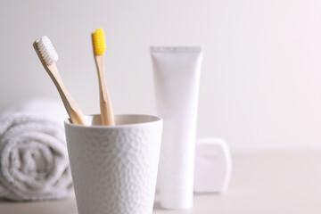 Different toothbrushes on a colored background. Dental care, oral health.