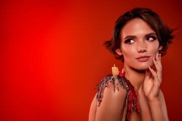 Obraz premium Photo of chic mysterious enchantress doing ritual magic for smooth skin touch on halloween night