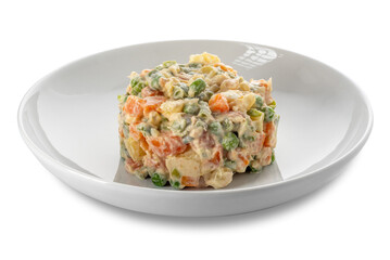 Russian salad in white plate, typical Piedmontese salad Italy made with pieces of vegetables with mayonnaise sauce.
