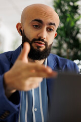 Project manager discussing product launch strategy with team in videocall using video conference software on laptop. Company financial analyst explaining report in online meeting