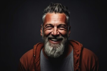Portrait of a happy senior man with gray beard and mustache.