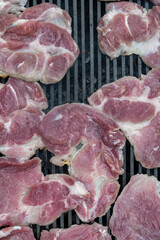Pork (pork neck) grilled on charcoal. Shot from above. It's time to grill! Barbecue.  Meat steak grilled on a stainless steel grill.