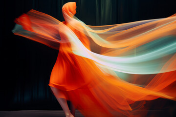 A young woman dances in waves of color. Dance, passion, beauty, love.