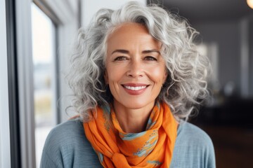 portrait of happy senior woman in scarf looking at camera at home - obrazy, fototapety, plakaty