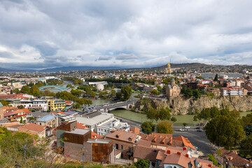Fototapeta na wymiar tbilisi city on a cloudy day and blue clouds in the sky