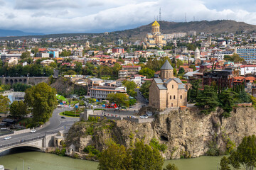 tbilisi city on a cloudy day and blue clouds in the sky