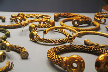 gold necklace on the table