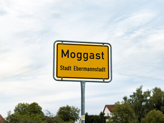 Moggast sign at the entrance of the small municipality as part of Ebermannstadt in Franconia, Germany. German town sign.