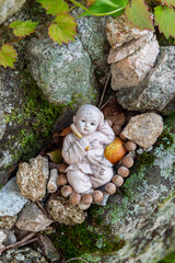 Small Statue Relaxing in a Stone Forest