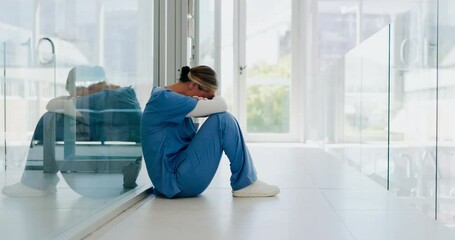 Doctor, stress and woman with depression, burnout and overworked in hospital, deadline and tired. Healthcare, medical professional and nurse crying for mistake, depressed and fatigue with anxiety