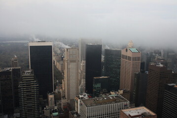 Manhattan in the fog from the height of a skyscraper.