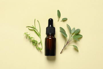 Bottle of essential oil and different herbs on beige background, flat lay