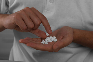 Closeup view of man with antidepressant pills