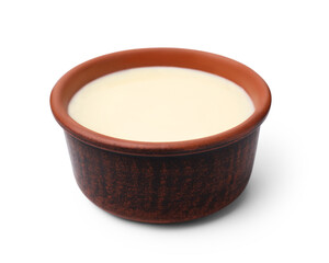 Bowl with condensed milk isolated on white