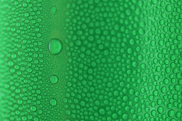 water drop on green beverage cans background, texture of cold aluminium drink package