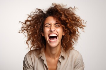 Portrait of a young woman with afro hairstyle screaming out loud