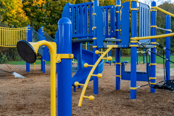 Unidentified typical elementary school playground with engineered wood fiber safety fall surface	