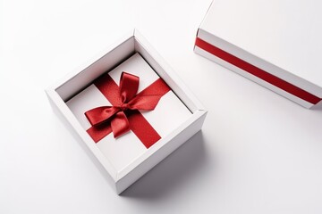 Picture of a white gift box with red ribbon On a white background, a high angle shot, the concept of giving a gift box, opening a box.