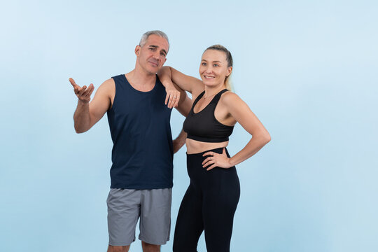 Active and fit physique senior people portrait with happy smile on isolated background. Healthy lifelong senior couple with fitness healthy and sporty body care lifestyle concept. Clout