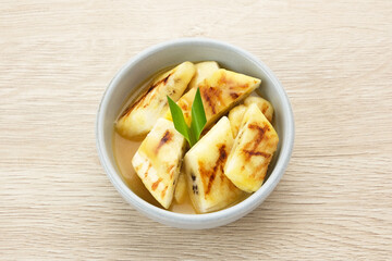 Pisang Gapit or Pisang Epe, grilled banana with palm sugar sauce. Indonesian traditional food.
