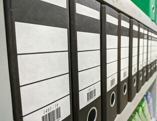 black binder folder on rack side angle