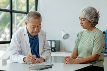 Doctor examining an elderly patient, An elderly patient is being diagnosed by a doctor in the...
