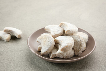 Kue Putri Salju or Snow White Cookies with crescent shaped. Made from flour, sugar and butter coated with powdered sugar. 
