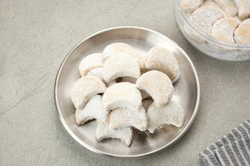 Kue Putri Salju or Snow White Cookies with crescent shaped. Made from flour, sugar and butter coated with powdered sugar. 
