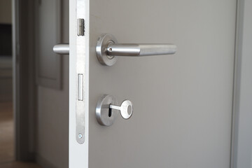  gray bathroom door slightly open .